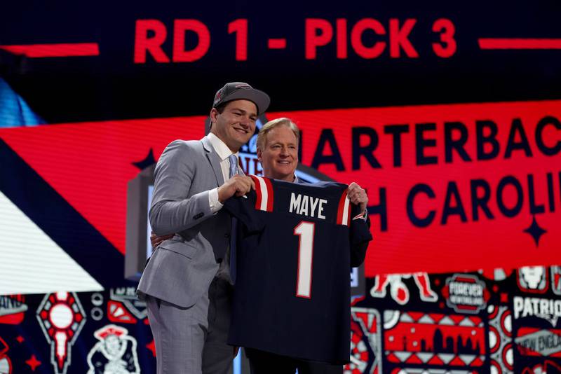 DETROIT, MICHIGAN - APRIL 25: (L-R) Drake Maye poses with NFL Commissioner Roger Goodell after being selected third overall by the New England Patriots during the first round of the 2024 NFL Draft at Campus Martius Park and Hart Plaza on April 25, 2024 in Detroit, Michigan. (Photo by Gregory Shamus/Getty Images)